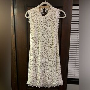 Open back, white laced dress with nude undertone from Francesca’s